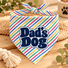A multicoloured striped pet bandana with a tie-neck loop, featuring the text 'Dad's Dog' in dark blue bubble letters with a white outline. Dads dog bandana. Funny slogan dog scarf tie on adjustable.