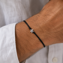 Star wish bracelet. Silver star bead charm in a black cotton cord bracelet. 