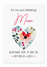 Plantable seed paper gift for mum. A white greeting card with the words 'The most amazing MUM' with a removable floral seed paper heart in the centre. Birthday gift for Mum. Mother’s Day gift 