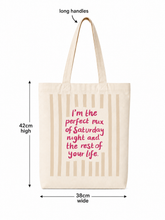 100% cotton tote bag reading I'm the perfect mix of Saturday night and the rest of your life in beige stripes with pink text