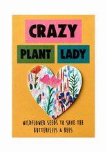 Plantable seed paper gift. A yellow greeting card with the words 'CRAZY PLANT LADY' with a removable floral seed paper heart in the centre. Plant lady gift 