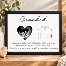 Personalised pregnancy announcement gift for grandparents. A personalised baby keepsake print on a wooden surface, featuring the word 'Grandparents,' a heart-shaped ultrasound photo, due date marked on calendar with a red heart mark, and a sentimental message.