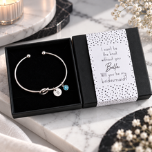 I can’t tie the knot without you, will you be my bridesmaid knot bangle and gift box. Personalised Silver knot bangle with 2 charms for bridesmaid proposal. Bridesmaid gift.