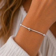 Heart wish bracelet. Silver heart on a white waxed cotton cord bracelet.