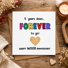 5 year anniversary card. A square white greeting card with colourful text reading '5 years down.