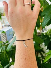 Mermaid wish bracelet. Silver mermaid charm on a black cord string. 