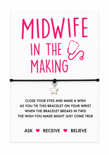 Student Midwife wish string bracelet. A midwife themed bracelet gift card with bright pink text reading 'MIDWIFE IN THE MAKING' and a small silver star charm on a black cord, displayed on a white background with wish string instructions below.
