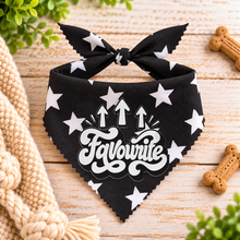 A black pet bandana with white star and arrow graphics, featuring the text 'Favourite' in a white script font. Cute slogan dog scarf