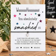 You smashed it wish string bracelet. A white card with a black cord bracelet attached, featuring playful text that says 'You absolutely smashed it!' with colourful stars. GCSE results gift 