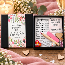 A black gift box with a floral wedding-themed label reading 'Marriage Survival Kit' and personalised names 'Kate & John' with the date '29.09. Customised wedding gift. Unusual wedding present. Personalised marriage survival kit 