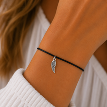Angel wing wish bracelet. Silver angel wing charm on a black cotton cord bracelet.