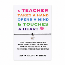 A teacher takes a hand, opens a mind and touches a heart wish bracelet. A teacher-themed bracelet gift card featuring a black cord bracelet with a small silver star charm, displayed on a white card with colourful inspirational text and instructions. Teacher gift.