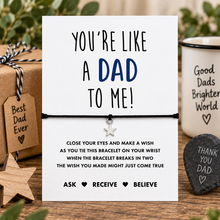 Like a dad to me wish string bracelet. A white presentation card with the message 'YOU'RE LIKE A DAD TO ME!' and a black bracelet with a small silver star charm. Gift for step dad