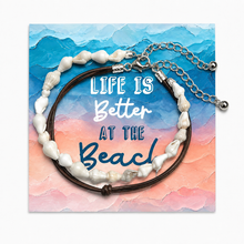 Set of 2 anklets with a life’s better at the beach presentation card. Holiday jewellery. 
