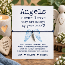 Angel wing wish string bracelet. A white memorial bracelet card with text reading 'Angels never leave they are always by your side' and a small angel wings charm tied with a black cord string.
