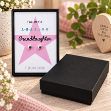Sterling silver star stud earrings displayed in a black presentation box with a printed card that reads 'The Most A-M-A-Z-I-N-G Granddaughter Sterling Silver,' gift for granddaughter. Silver star stud earrings.