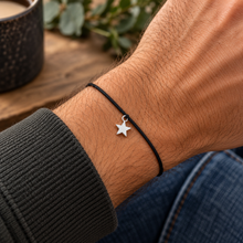 Star wish string bracelet. Silver star on a black waxed cotton cord. A wish string for him.