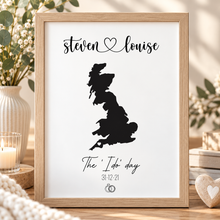A black-and-white personalised wedding print featuring a black silhouette map of UK with the names 'sloan & peter' at the top and 'Tied the knot 11 June 2022' below, customised anniversary gift 