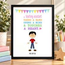 A personalised teaching assistant print displayed on a wooden desk. The print features a colorful bunting banner and the text 'A teaching assistant TAKES A HAND OPENS A MIND & TOUCHES A HEART. Gift for teaching assistant 