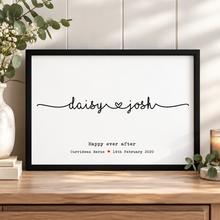 A personalised framed wedding print with the names 'daisy & josh' in black script on a white background