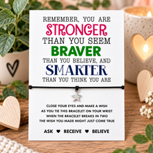 Stronger braver smarter wish string bracelet. Inspirational card including a bracelet made with black cord and a silver star charm. 
