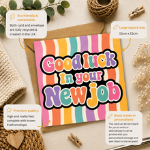 A colorful greeting card with the phrase 'Good luck in your New job' in large multicolored bubble letters, shown on top of a kraft envelope with decorative dried flowers, leaves, and a small coil of twine. Callout boxes around the product describe eco-friendly sustainability, large square size (15cm x 15cm), premium quality, and blank/included options.