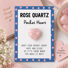 A rose quartz pocket heart card with a blue and pink polka dot border, featuring a small polished pink rose quartz crystal heart in the centre. The card reads 'ROSE QUARTZ Pocket Heart' and 'KEEP YOUR POCKET HEART SAFE AND CLOSE SO IT'S THERE WHEN YOU NEED IT MOST.