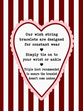A heart-shaped informational graphic with a scalloped pink border and black text on a red-and-white striped background. The text says: 'Our wish string bracelets are designed for constant wear.