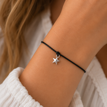Star wish bracelet. Silver star charm on a black cotton cord bracelet. 