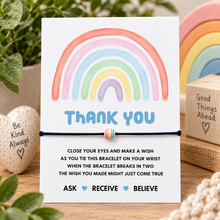 Thank you wish string bracelet. Black cotton cord bracelet with rainbow bead charm. Displayed on the thank you keepsake card with wish instructions. 
