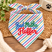Bad mutha fluffer dog bandana in multi coloured stripe print with blue green and red text. Funny slogan dog scarf. Adjustable tie on dog bandana. Bad Mother Fluffer.