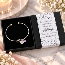 Bridesmaid gift. We couldn’t have tied the knot without you, thank you for being our bridesmaid. Personalised silver knot bangle with initial and birthstone charms. Bridesmaid favour. 