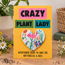 Plantable seed paper gift. A yellow greeting card with the words 'CRAZY PLANT LADY' with a removable floral seed paper heart in the centre. Plant lady gift 