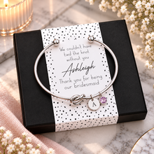 Bridesmaid gift. We couldn’t have tied the knot without you, thank you for being our bridesmaid. Personalised silver knot bangle with initial and birthstone charms. Bridesmaid favour. 