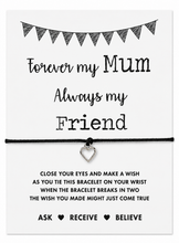 Bracelet for Mum. A black cord bracelet with a small silver heart charm displayed on a white card that reads 'Forever my Mum, Always my Friend' with wish instructions below. Mother’s Day gift.