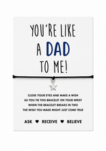 Stepdad wish string bracelet. A black cord bracelet with a small silver star charm displayed on a keepsake card that reads 'YOU'RE LIKE A DAD TO ME!' with wish instructions below. Stepfather gift. Father’s Day present 