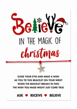 A Christmas-themed wish bracelet gift with the phrase 'Believe in the magic of Christmas' in red and black lettering, a red cord bracelet with a small silver star charm, and printed instructions below. Christmas Eve box gift. 