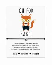 Funny birthday gift. Birthday card filler. FFS bracelet. A white rectangular bracelet card with a cartoon fox wearing glasses and a bow tie, above a black cord bracelet with a silver star charm. The card reads 'OH FOR SAKE!' and includes instructions and the phrases 'ASK ♥ RECEIVE ♥ BELIEVE' at the bottom.