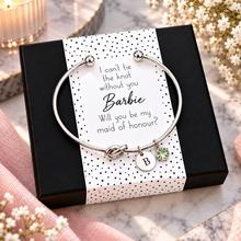 I can’t tie the knot without you, will you be my maid of honour knot bangle and gift box. Personalised Silver knot bangle with 2 charms for maid of honour proposal. Maid of honour gift.