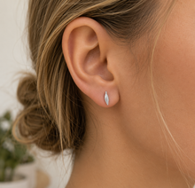 Sterling silver feather studs. Delicate feather earrings in silver.