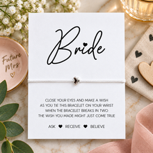 Bride wish string bracelet. White cotton cord bracelet with small silver heart bead charm. Displayed on the bride keepsake card with wish instructions. 