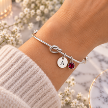 Personalised Silver knot bangle with initial and birthstone charms 