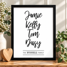 A black-framed personalised print with the names family’s first names in large black script, plus 'THE BUSHELL FAMILY' family print gift. Housewarming present for new home 