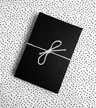 black gift box with white bow