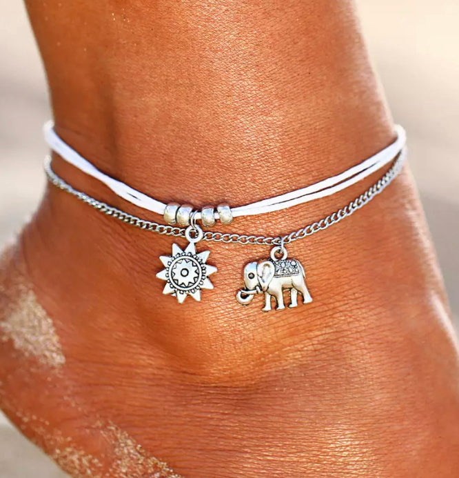 white and silver ankle chain